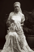 Woman in wedding gown, looking down, portrait - Alex Mares-Manton