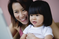 Mother with young daughter, portrait - Yukmin