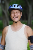 Mature adult wearing sports helmet - Yukmin