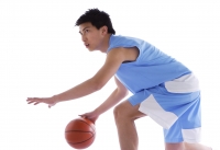 Young man playing basketball - blueduck