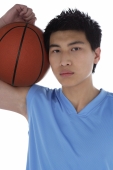 Young man with basketball, portrait - blueduck