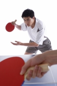 Two men playing table tennis - blueduck