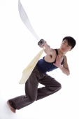 Young man practicing Kong fu with sword - blueduck