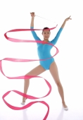 Woman performing rhythmic gymnastics with ribbon - blueduck