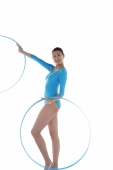 Rhythmic gymnast performing with hoop - blueduck