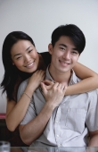 Couple embracing, smiling at camera - Yukmin