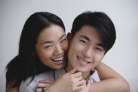 Couple embracing, smiling at camera - Yukmin