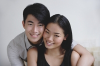 Couple embracing, portrait - Yukmin
