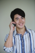Young man using mobile phone - Yukmin