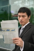 Businessman using reading newspaper - blueduck