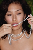 woman biting necklace, seductive - Yukmin