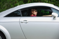 Woman driving sports car, wearing sunglasses - Yukmin