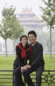 A couple smile at the camera as they in front of The Forbidden City, Beijing - Alex Mares-Manton