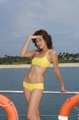 Young woman on yacht, looking at camera - Yukmin