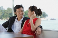 Young couple on yacht, looking at each other - Yukmin
