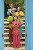 Balinese girls smiling at camera - Cedric Lim