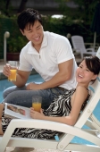 Young couple laughing at the pool - Cedric Lim