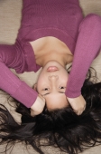 Young woman looking upside down at camera - Yukmin
