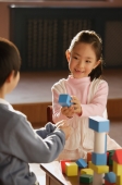 Young children playing with building blocks - Alex Mares-Manton