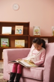 Young girl reading a book - Alex Mares-Manton