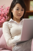 Young woman using laptop - Alex Mares-Manton