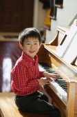 Little boy playing piano - Alex Mares-Manton