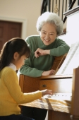 Girl playing piano for grandmother - Alex Mares-Manton