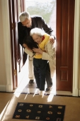 Girl greeting grandparents at door - Alex Mares-Manton