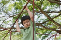 Young boy playing at the park, looking at camera - Yukmin