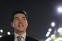 Head shot of smiling young man at night - Alex Mares-Manton