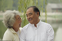 Head shot of older couple looking at each other and smiling. - Alex Mares-Manton