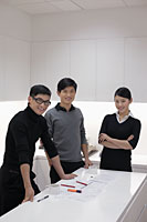 Three people working together in modern office - Alex Mares-Manton