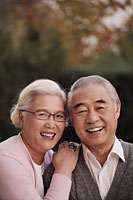 Head shot of older couple smiling together - Alex Mares-Manton