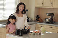 Mother and daughter making food together - Alex Mares-Manton