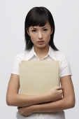 Secretary holding files - Asia Images Group