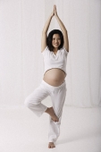 Pregnant woman practicing yoga - Asia Images Group