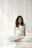 Pregnant woman doing yoga - Asia Images Group