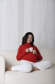 Pregnant woman enjoying tea - Asia Images Group