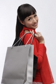 Young woman with shopping bags - Asia Images Group