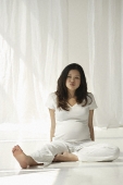Pregnant woman relaxing - Asia Images Group