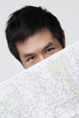 Man with map - Asia Images Group