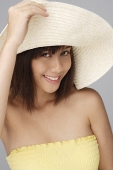 Young woman with big sun hat - Asia Images Group