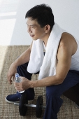 Man drinking water after workout - Asia Images Group