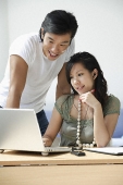 Young couple working at computer - Asia Images Group