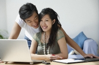 Young couple working at computer - Asia Images Group
