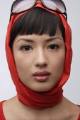 Portrait of woman wearing red sweater, scarf and sunglasses - Asia Images Group