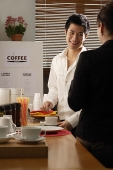 Colleagues chatting on coffee break - Asia Images Group