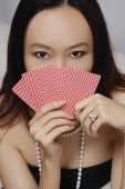 Young woman holding cards - Asia Images Group