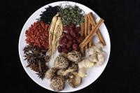 Still life of natural items such as cinnamon sticks, ginger root, mushrooms, star anise, etc. - Asia Images Group