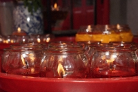 Close up of candles at temple altar - Asia Images Group